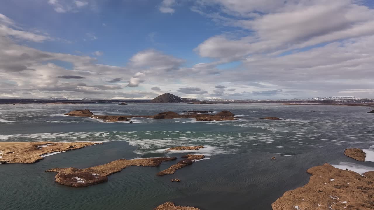 Sunny day in Iceland. Horizon with clouds in the distance. Drone view of Reykjahlíð, Sees Mývatn, Skútustaðir