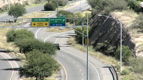 vehicles travel along a highway close to the mexican boarder