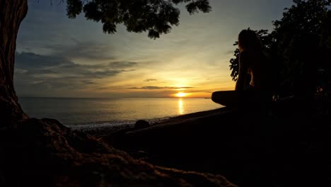 timelapse man silhouette on sunset over beach and colorful dramatic sky moving clouds