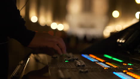 Sound-technician-working-at-concert,-close-up-view