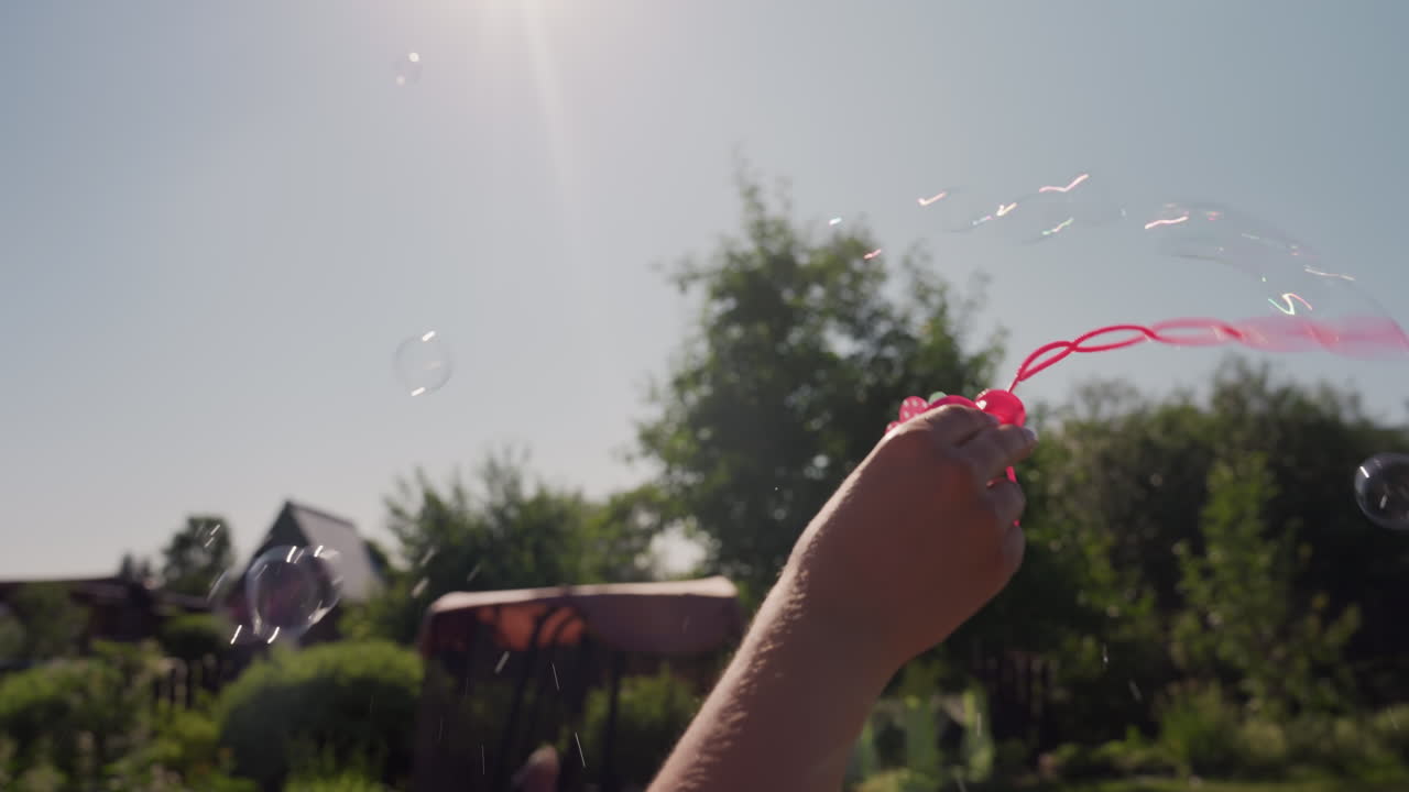 Colorful Outdoor Scene With Dancing Ribbons, Vivid Floral Setting Featuring Flowing Ribbons And Sparkling Trails, Sunlit Garden Scene With Waving Pink Ribbons And Shimmering Bubble Streams