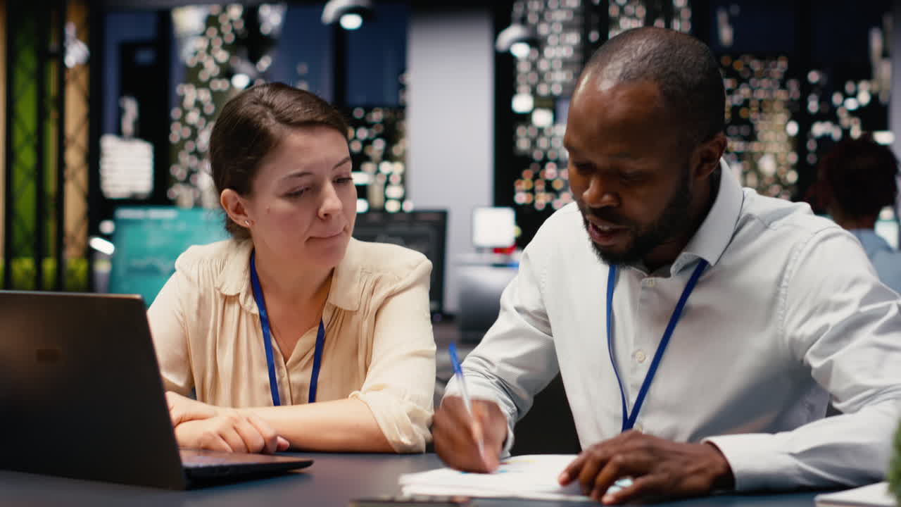 Office scene featuring partners working at night on company project