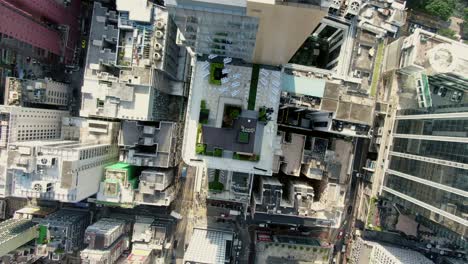 central hong kong, top down aerial view of traffic and city skyscrapers