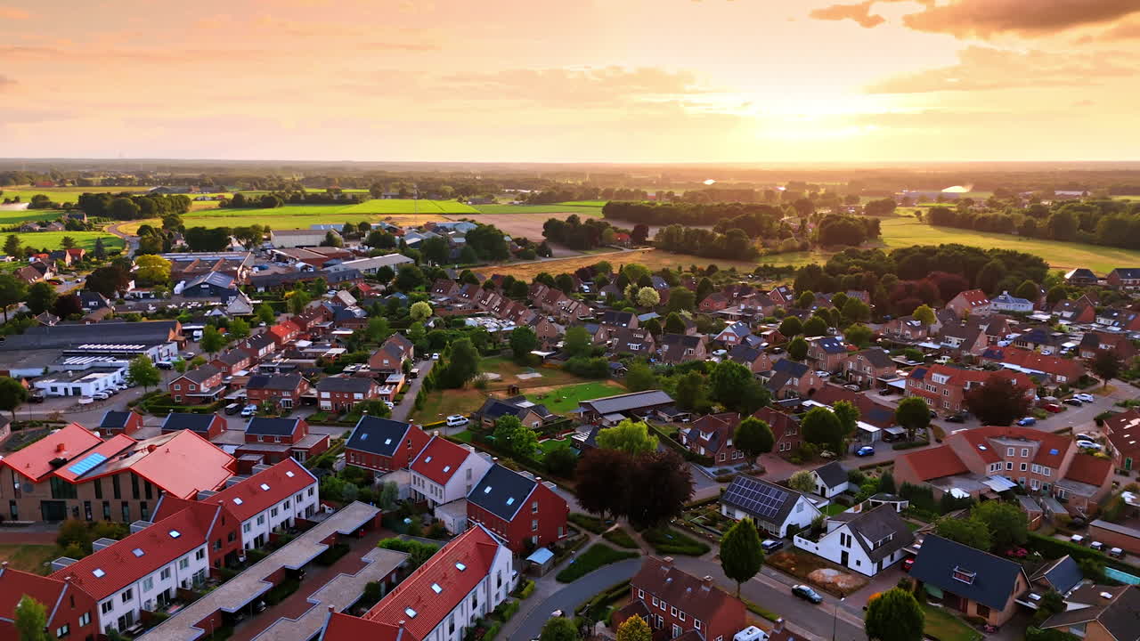 Sunset over rural Dutch settlement. A wide sunset view over a Dutch settlement beside open farmland