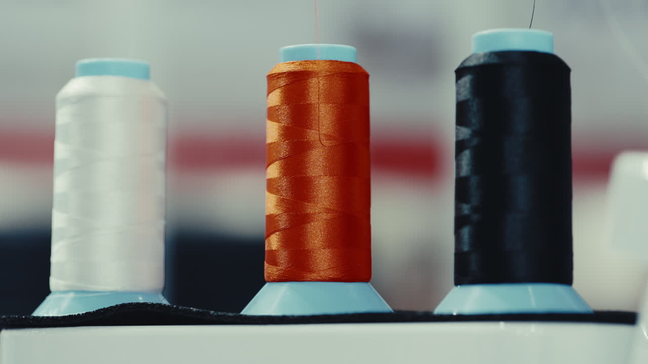 Three spools of thread
