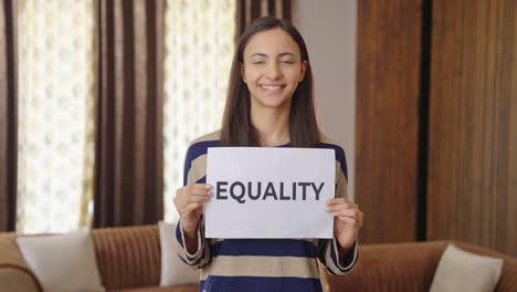 happy indian woman holding equality banner