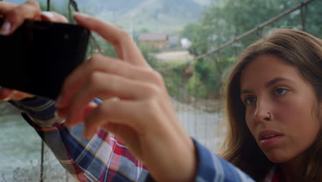 traveler girl posing selfie on cellphone outside. woman taking picture at nature