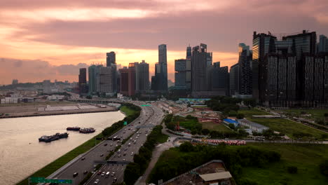 Panoramic Cityscape with Highway Traffic and Waterfront at Sunset