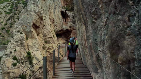 hiker ascending steep canyon stairs at el cabrito, slow-motion capture