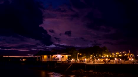 4k time lapse, people are dining in a restaurant on a cloudy day, at dusk.