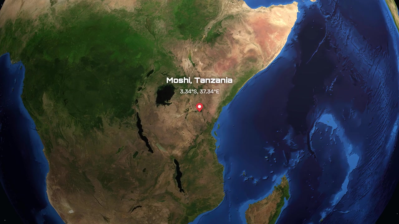 Vista satelital se acerca desde el espacio a África Oriental, señalando Moshi, Tanzania con texto y coordenadas.