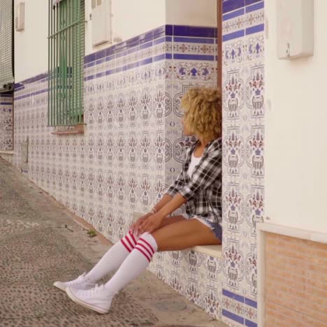 model walks the mediterranean street along