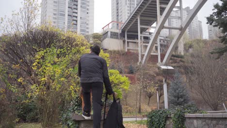 sad lonely young man looking thoughtfully at the city.