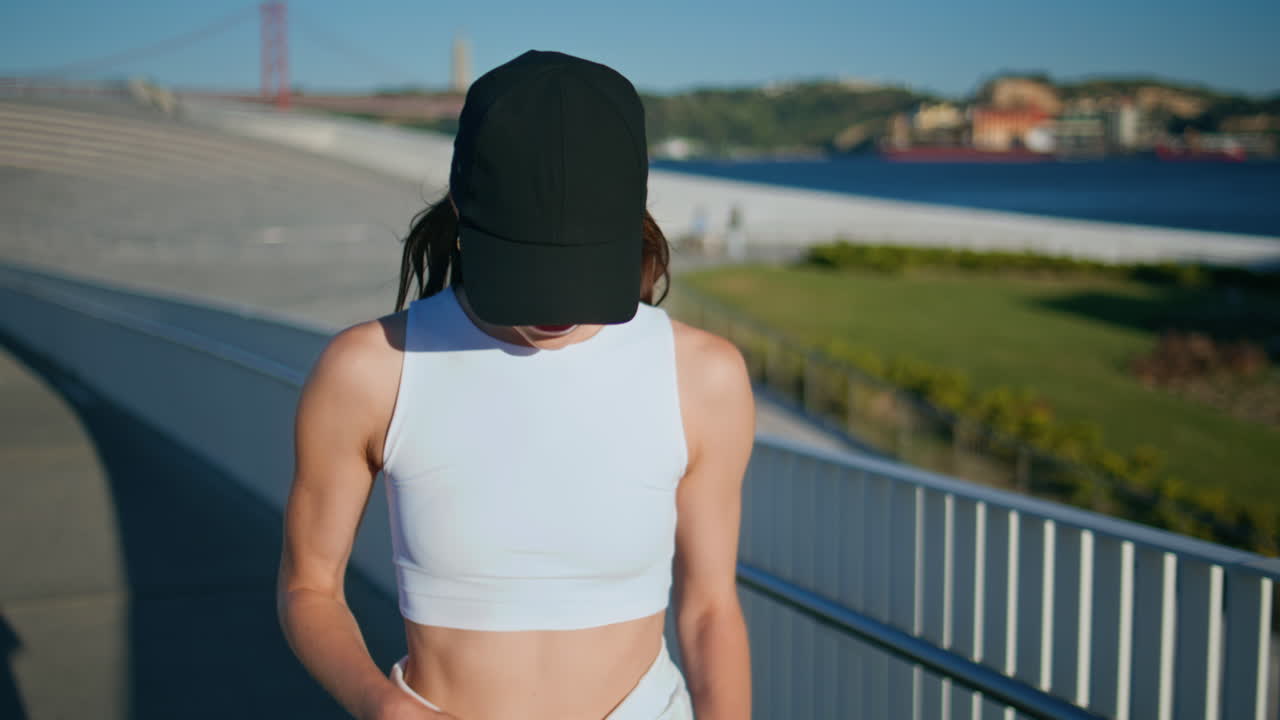 Athletic woman smiling street exploring urban area walking sunny day closeup