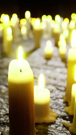 soft candlelight flickers in dimly lit space creating peaceful atmosphere