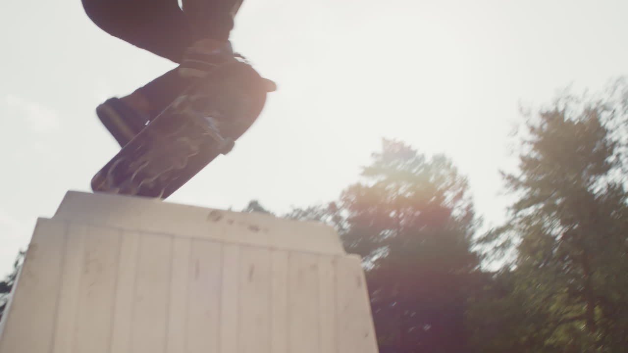 Skater Jumping Over Obstacle in Skatepark