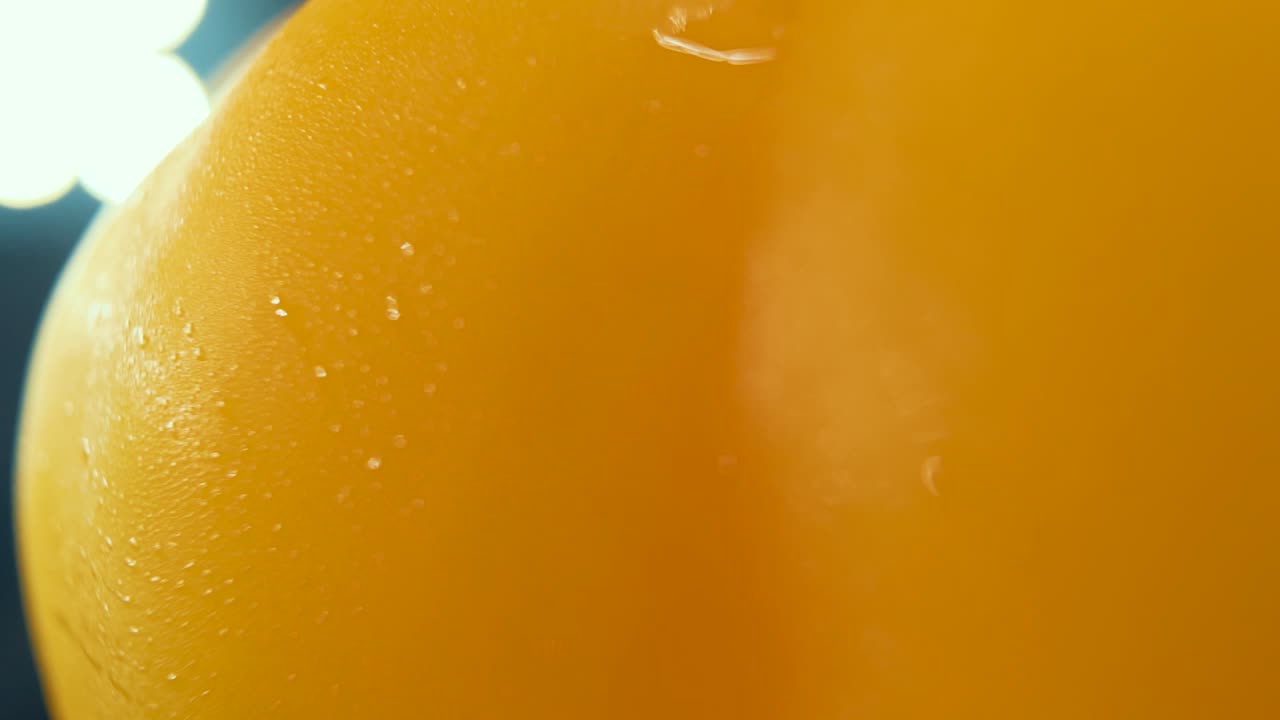 A macro close up crispy detailed shot of a wet sweet yellow pepper on a 360 rotating stand, shiny sweaty water drops, cinematic studio lighting, super slow motion, 120 fps, smooth movement, Full HD