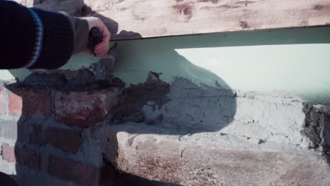 Cropped-View-Of-A-Person-With-Concrete-Trowel-Plastering-Diy-Hot-Tub