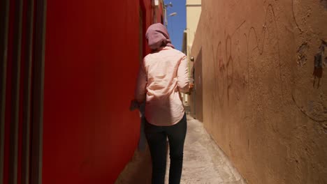 young woman wearing hijab out and about in the city