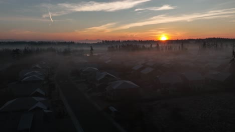 aerial view of a foggy neighborhood at dawn on a cold winter morning