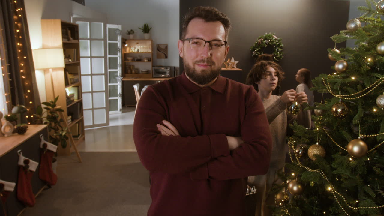 Family Decorating Christmas Tree at Home