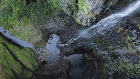 Aerial-is-turning-clockwise-above-at-Waterfall-Risco,-Madeira