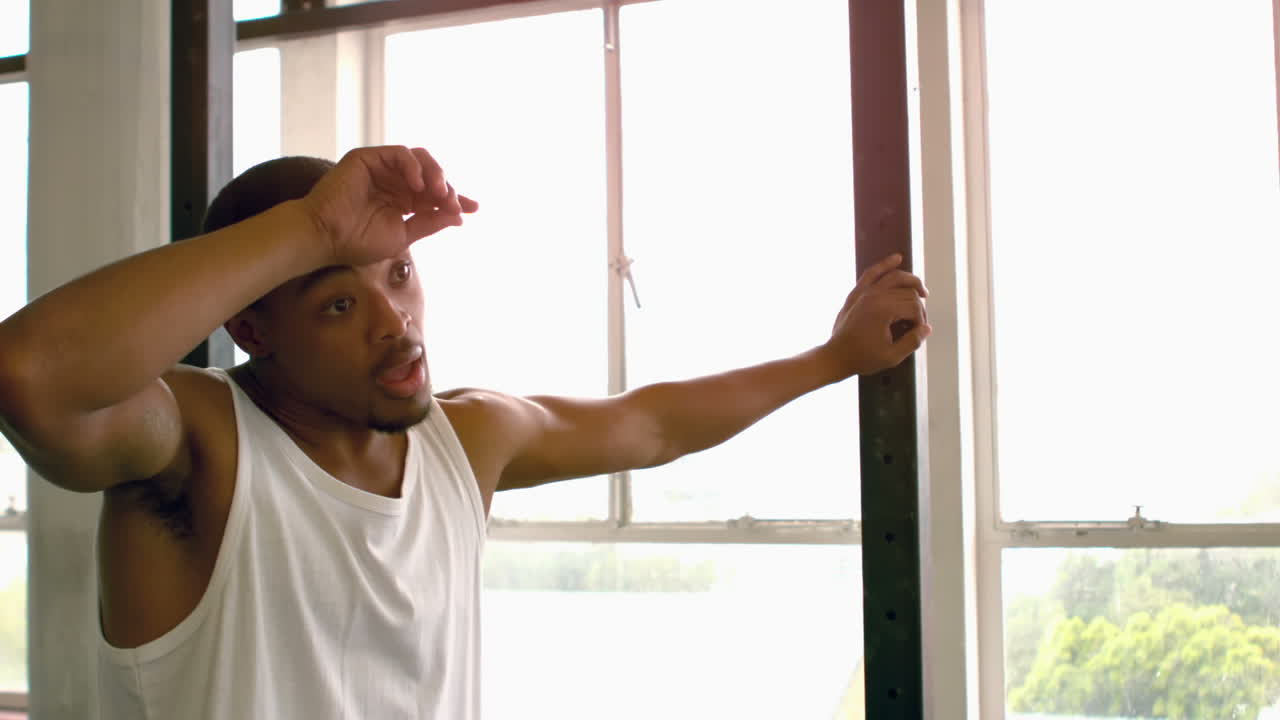 Fit man taking a break from working out