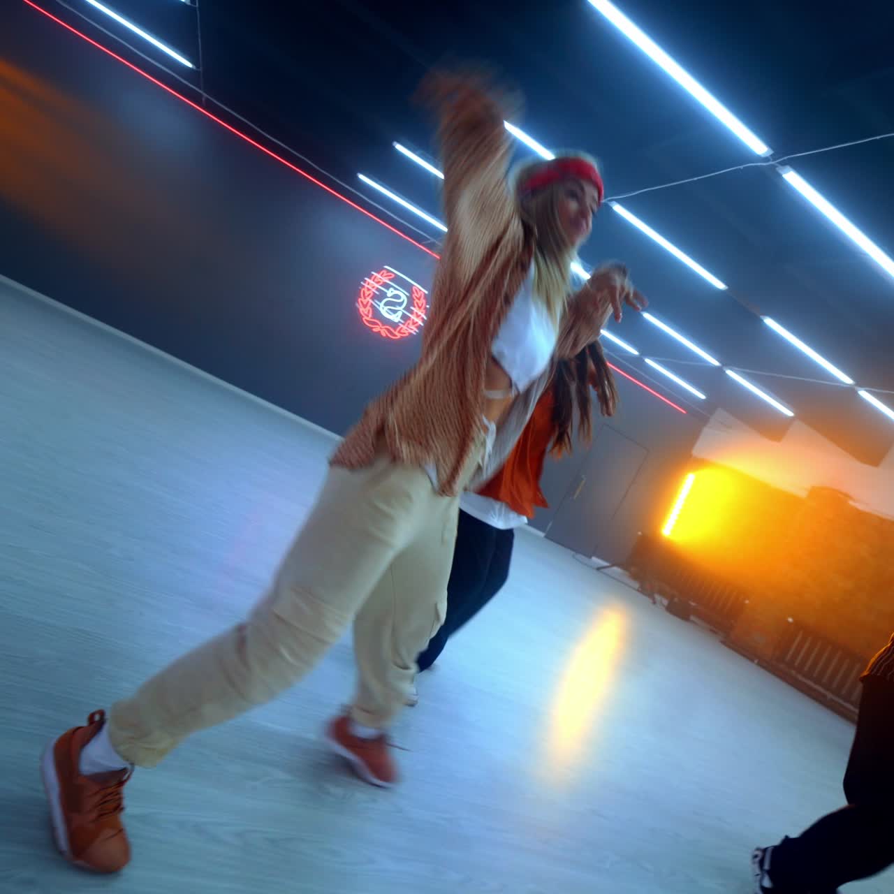 Hip-hop dancers in motion. Group of people modern dancing in studio