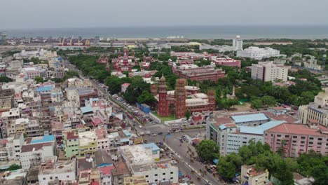 high court of judicature at madras background tamil nadu secretariat with port area and heavy traffic with crowded residentials buildings in chennai, tamil nadu, day time push in drone shot