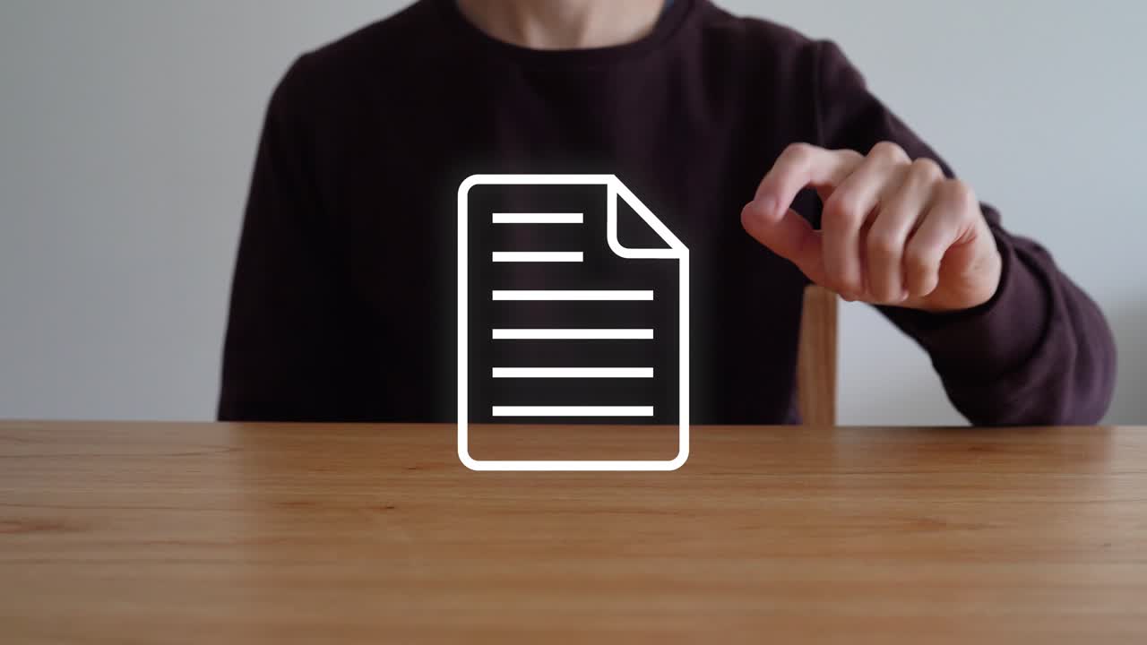 Person Sitting At Wooden Table, Touching Document Icon To Make It Disappear. closeup shot