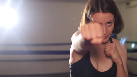 young woman learning boxing in the gym young woman learning boxing in the gym woman boxing in the gym fighting with the shadow boxing concept