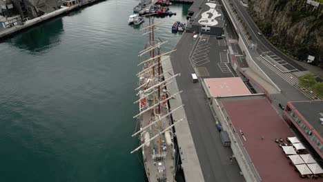 masted ship docked on the coast of funchal in madeira, portugal