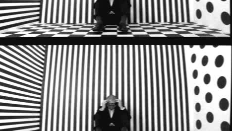 Man Seated in Optical Illusion Room