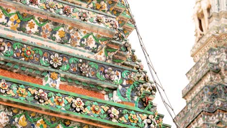 detailed view of wat arun's ornate mosaic tiles