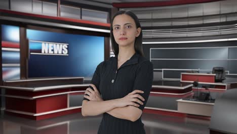 portrait of indian female news journalist standing crossed hands