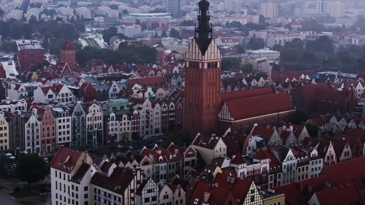 Drone shot over historic Polish town Elblag in strong rain, northern wind mood