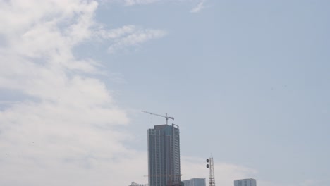 mumbai city skyline with construction cranes in india