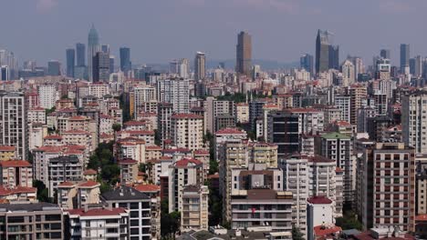 cinematic pan up reveals istanbul skyline with tall apartment buildings, complex