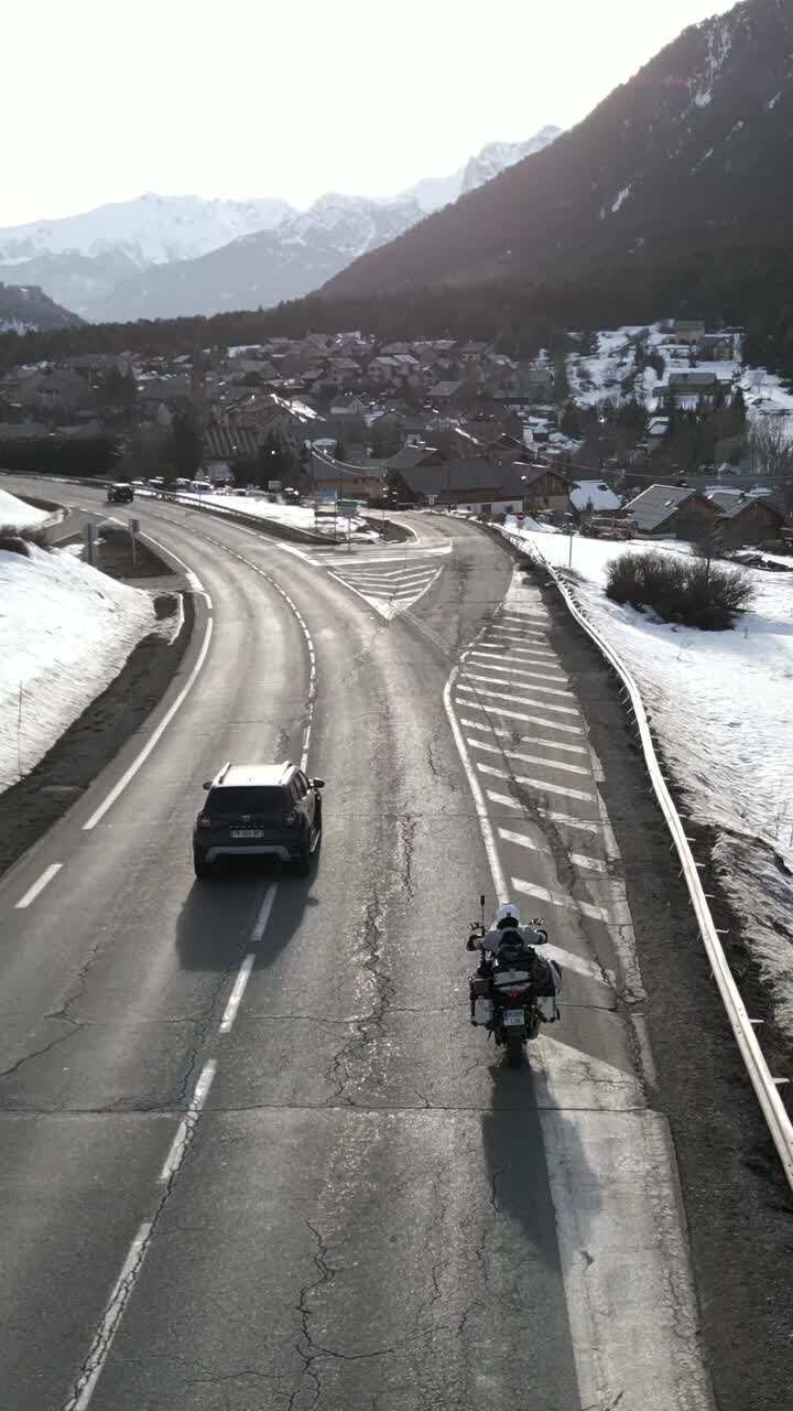 Motorcycle ride through snowy mountain roads