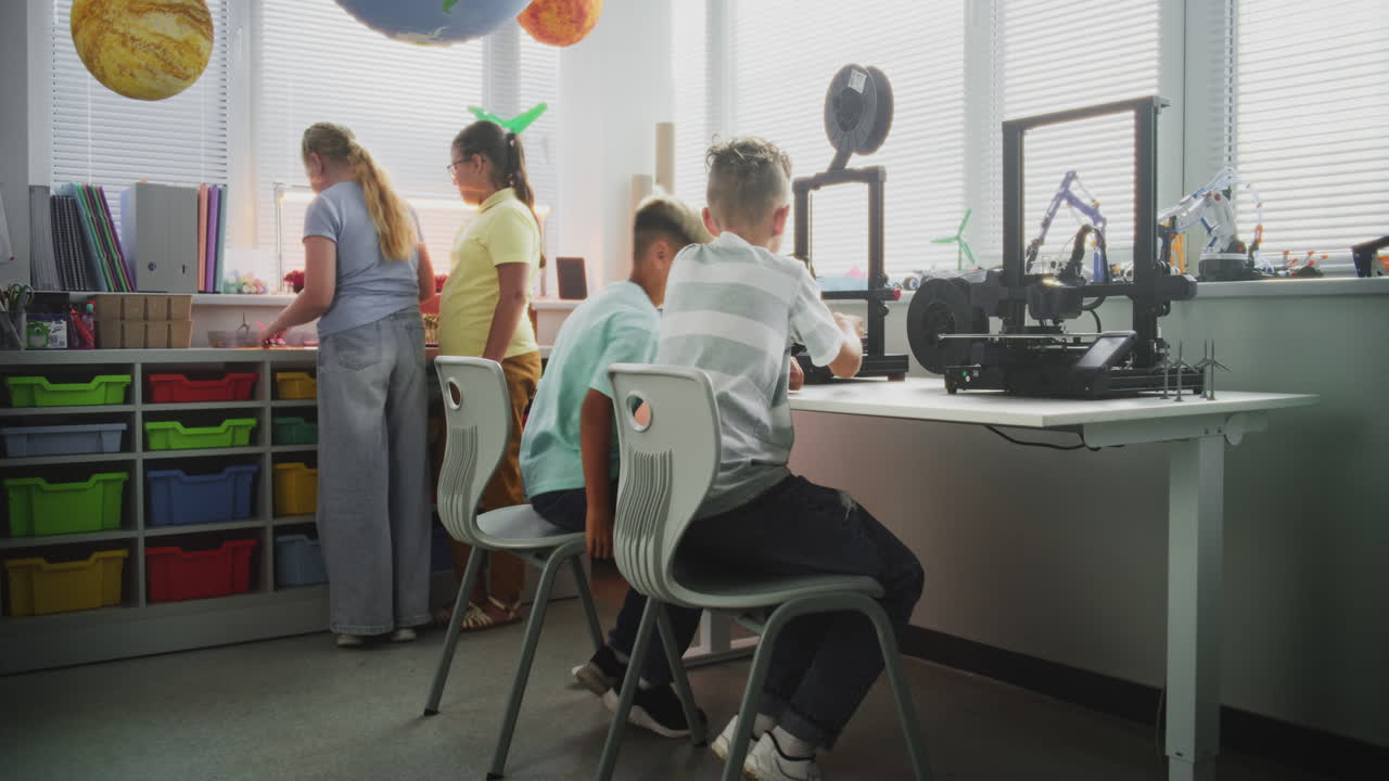 Talented Young Boys Studying Advanced Automated 3D Printer During Programming Lesson