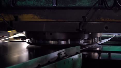 steel coils are fed into the machine to be punched into drum can lids