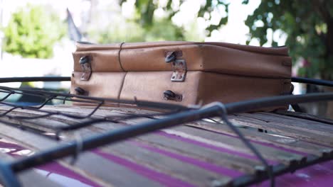 vintage suitcase on a car roof rack