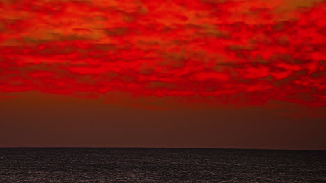 stunning red sunset time lapse with dramatic cloudy sky at red sea, hurghada egypt