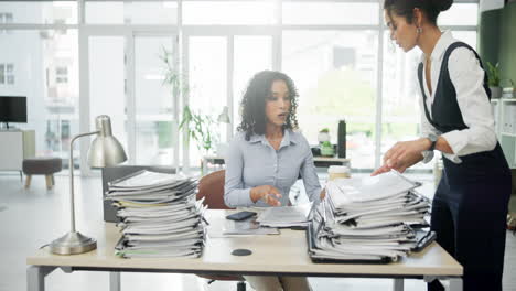 businesswomen working in modern office with coffee and documents