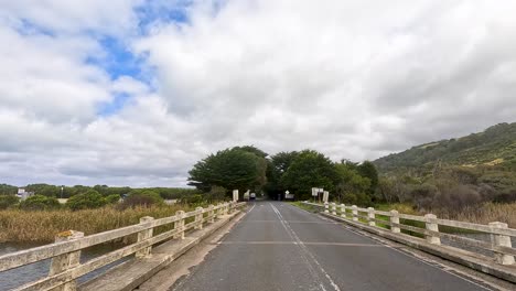 a serene drive through lush landscapes and coastal views on great ocean road, captured in natural daylight