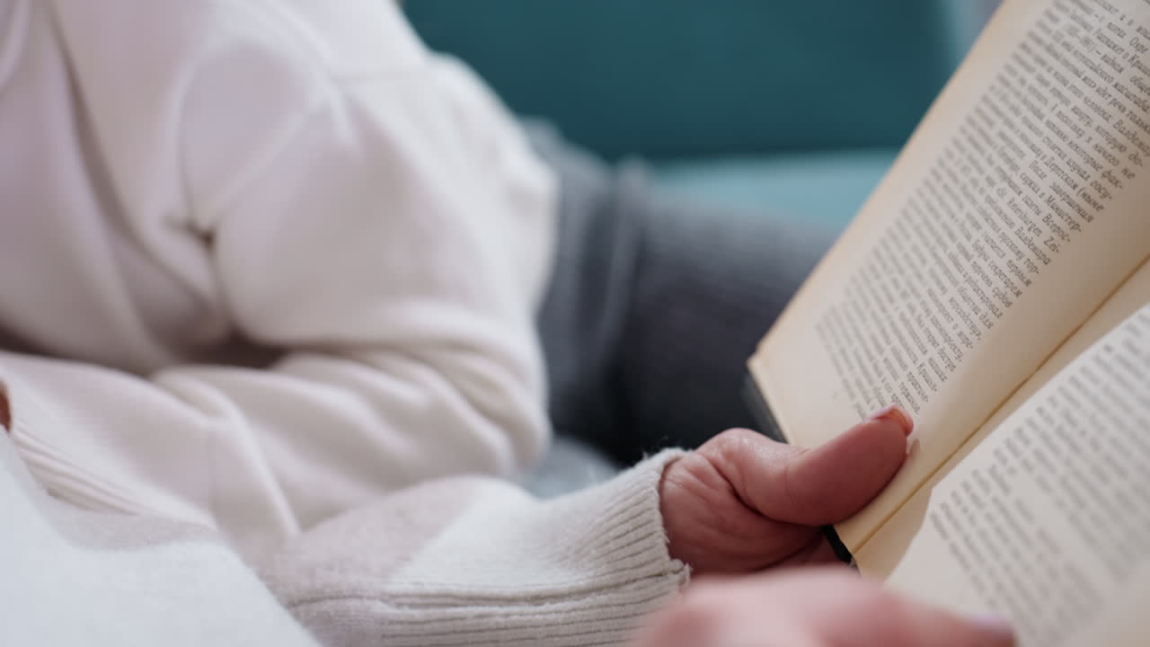 Little girl with closed eyes resting head on mother chest while cuddling together on couch, peaceful family moment showing love, comfort, warmth, trust, tenderness, maternal bond, childhood relaxation