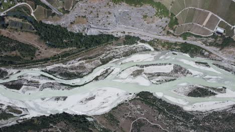 famous river "rhone" in the valley of valais in south of switzerland, 4k drone-shot from above