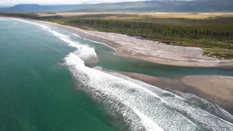 seascape at maori beach, bruce bay, new zealand - aerial drone shot