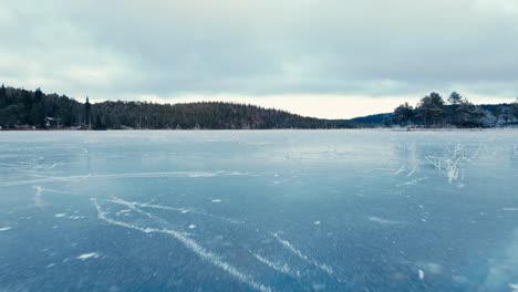 indre fosen, trondelag county, norway - a sight of omundvatnet's frozen expanse - drone flying forward