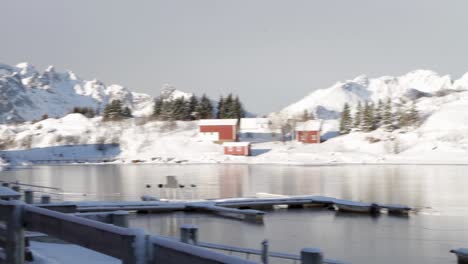 Beautiful-Polo-Houses-Lagoon,-Near-Snowy-Mountains,-Svolvaer,-Lofoten,-Norway